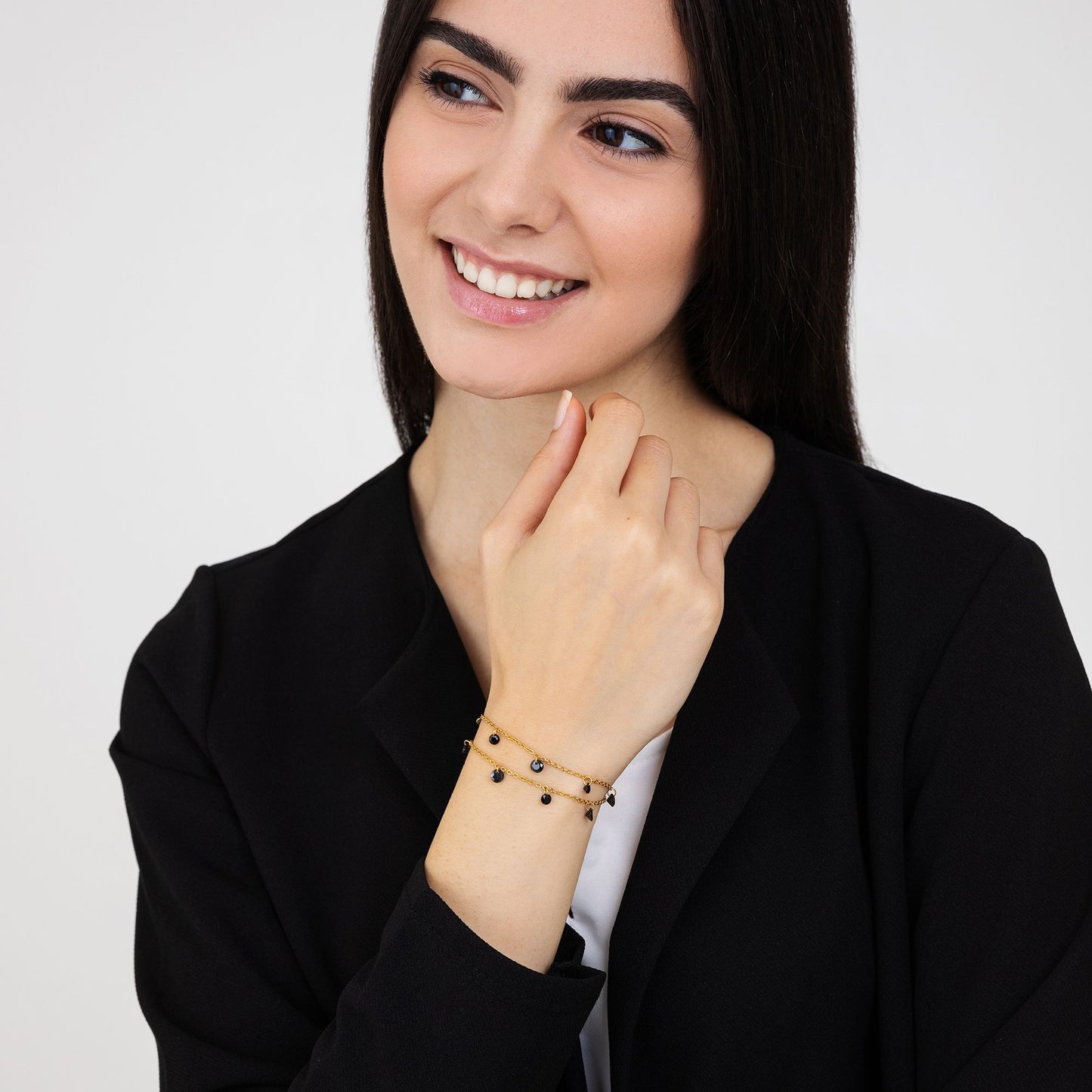 BRACCIALE DONNA IN ACCIAIO DORATO CON CRISTALLI NERI