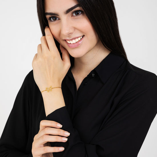 BRACCIALE DONNA IN ACCIAIO DORATO CON FARFALLA VUOTA