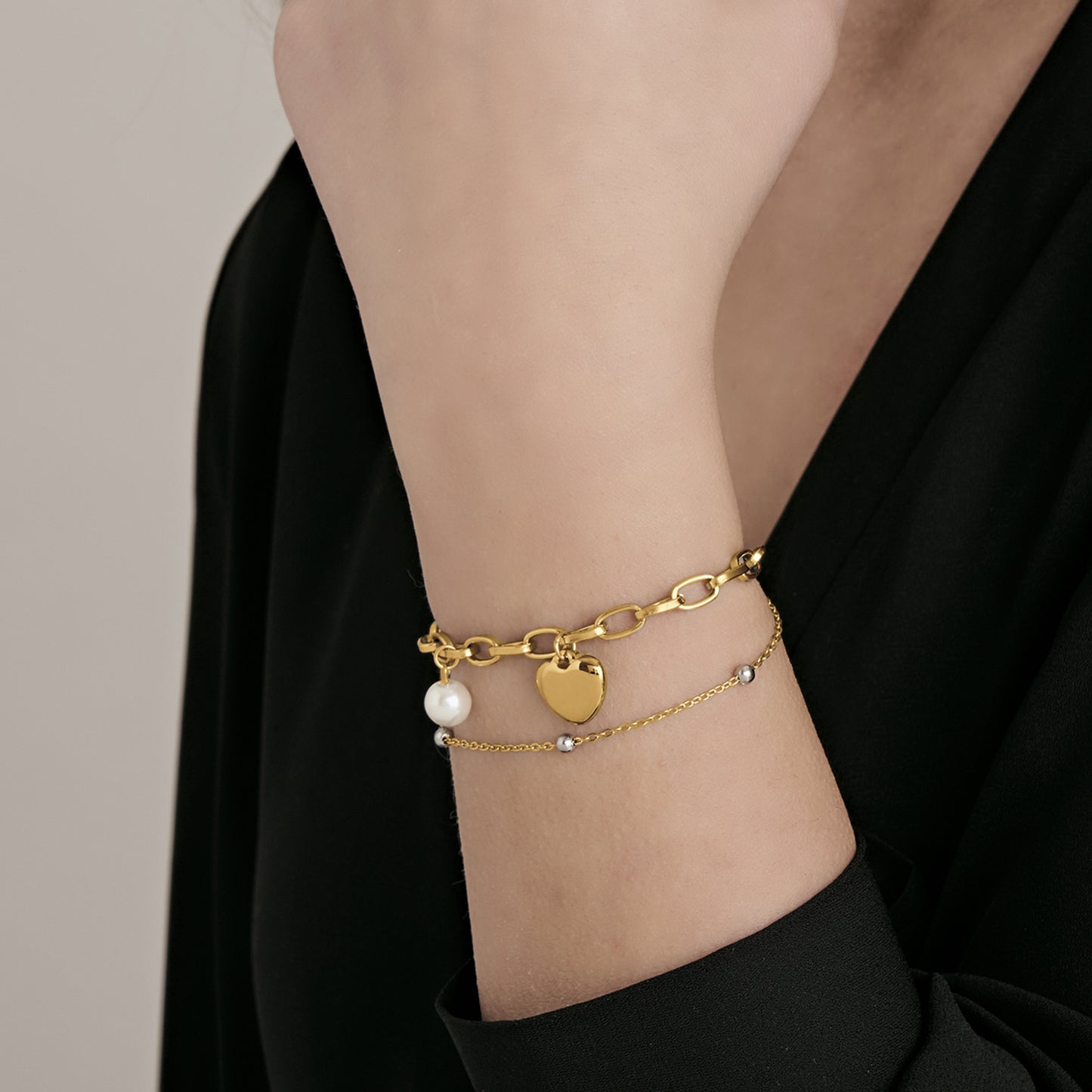 BRACCIALE DONNA IN ACCIAIO CON CUORE E PERLE