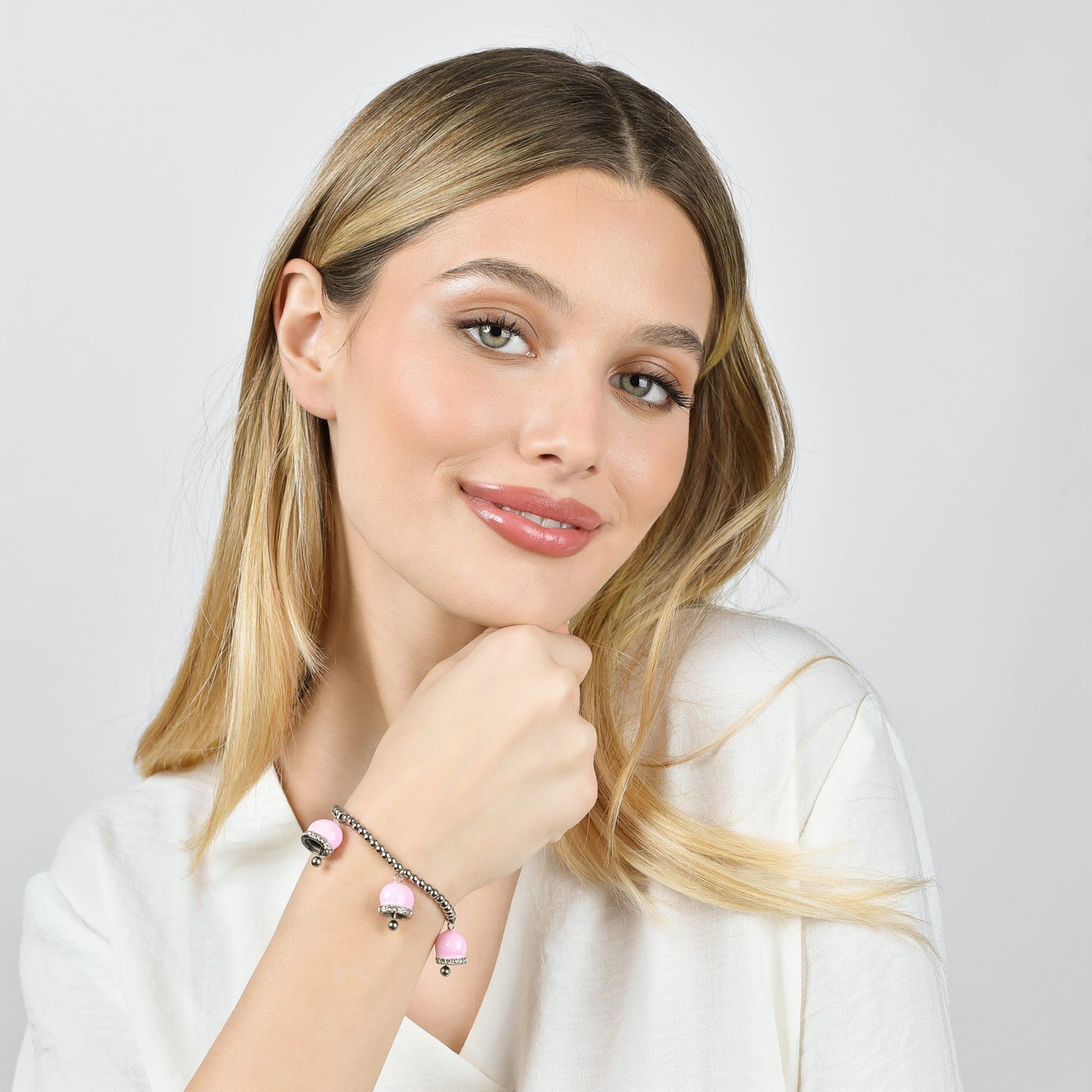 BRACCIALE DONNA IN ACCIAIO CON CAMPANELLE CON SMALTO ROSA E CRISTALLI BIANCHI