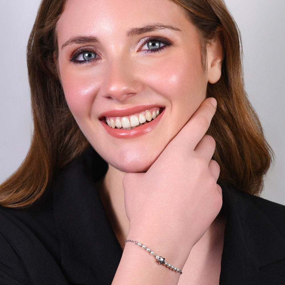 BRACCIALE DONNA IN ACCIAIO E PERLE SINTETICHE BIANCHE CON STELLA