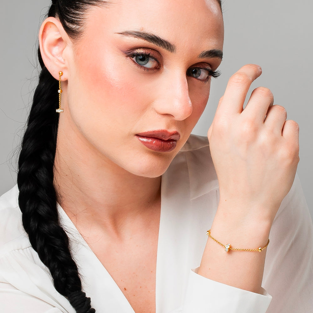 BRACCIALE DONNA IN ACCIAIO IP GOLD, BUSSOLOTTO ED ELEMENTI CON ZIRCONI BIANCHI