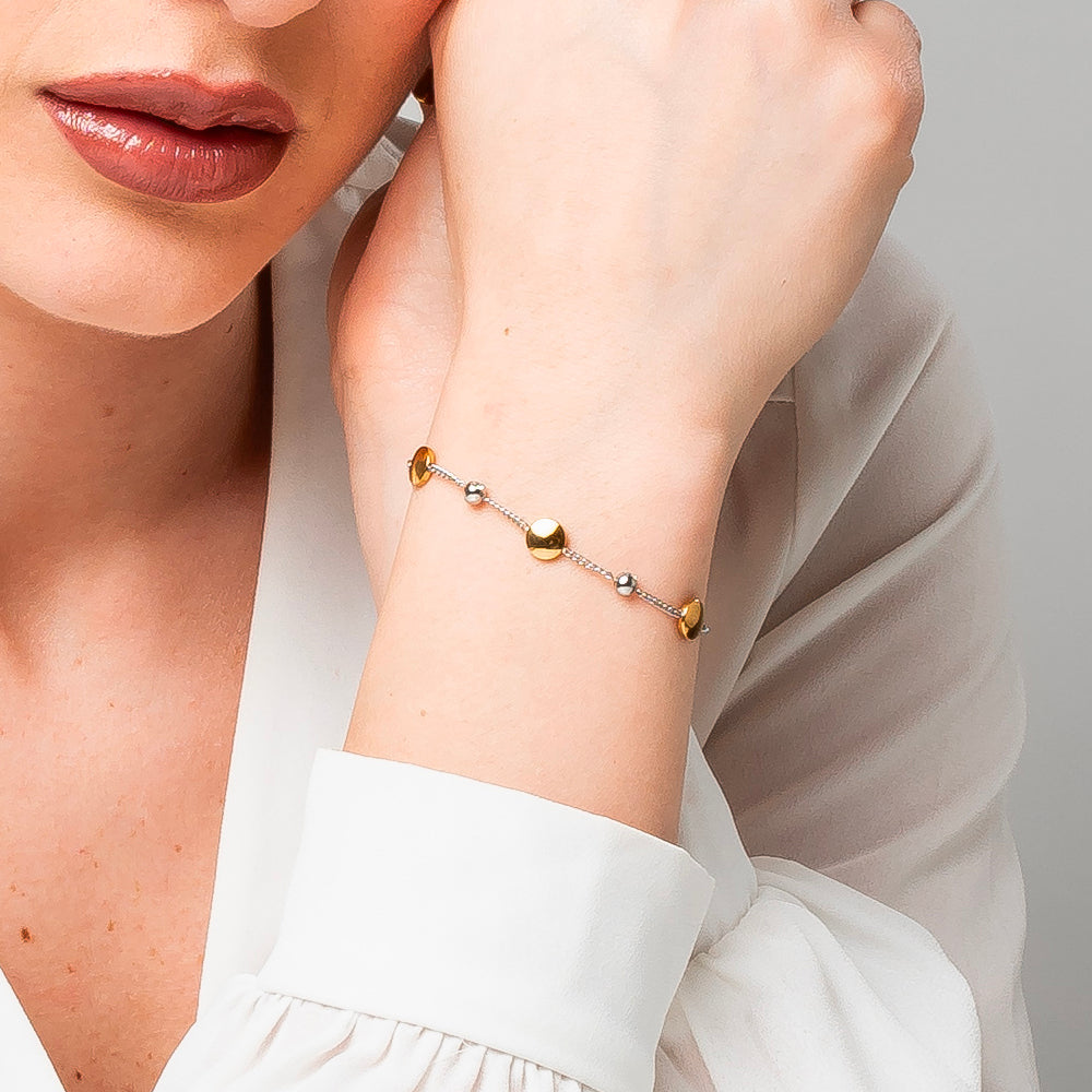 BRACCIALE DONNA IN ACCIAIO CON ELEMENTI IN ACCIAIO IP GOLD E CRISTALLI BIANCHI