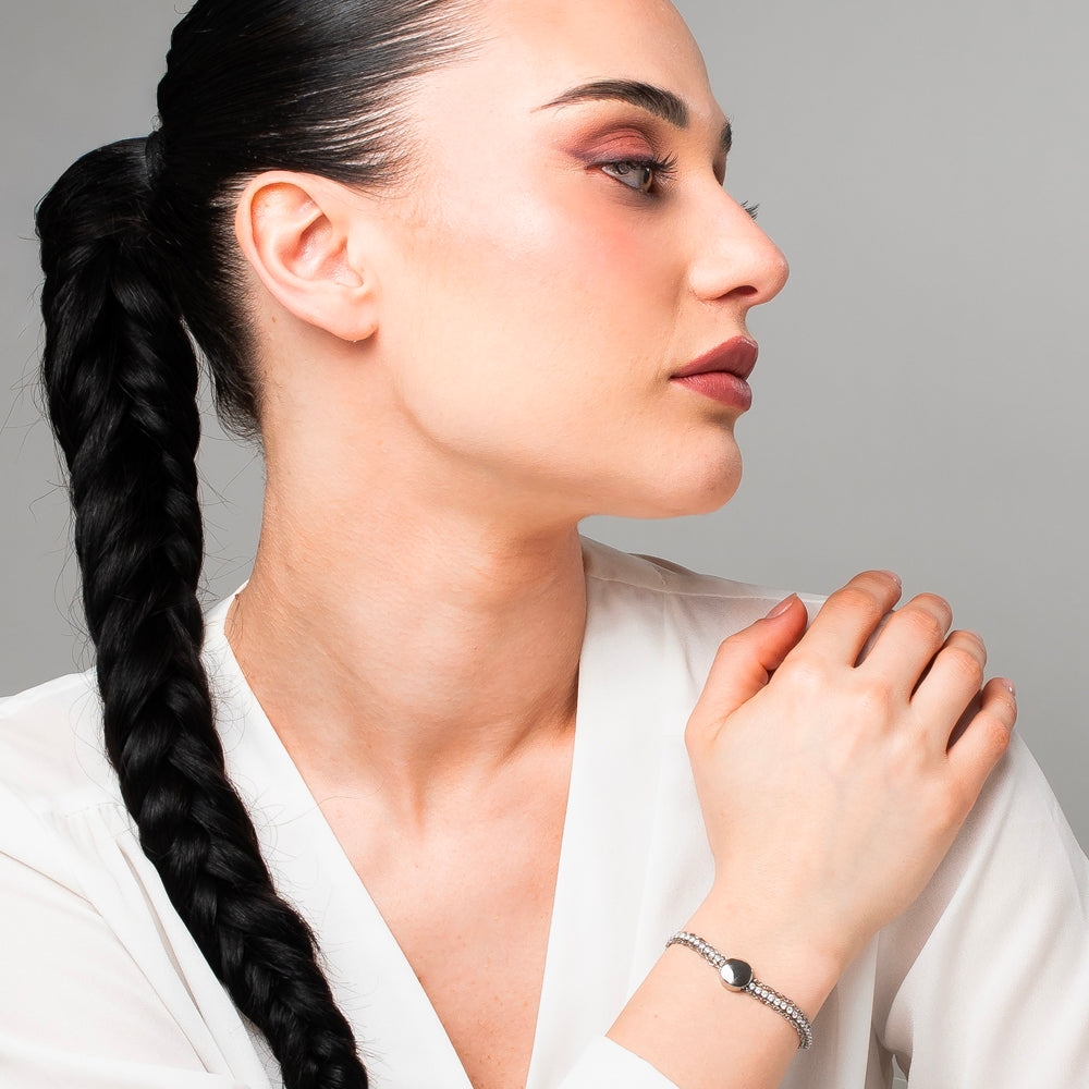 BRACCIALE DONNA TENNIS IN ACCIAIO CON ELEMENTO CENTRALE IN ACCIAIO E CRISTALLI