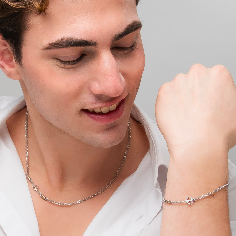 COLLANA UOMO IN ACCIAIO CON ANCORA, ZIRCONE NERO ED ELEMENTI IN IP GOLD
