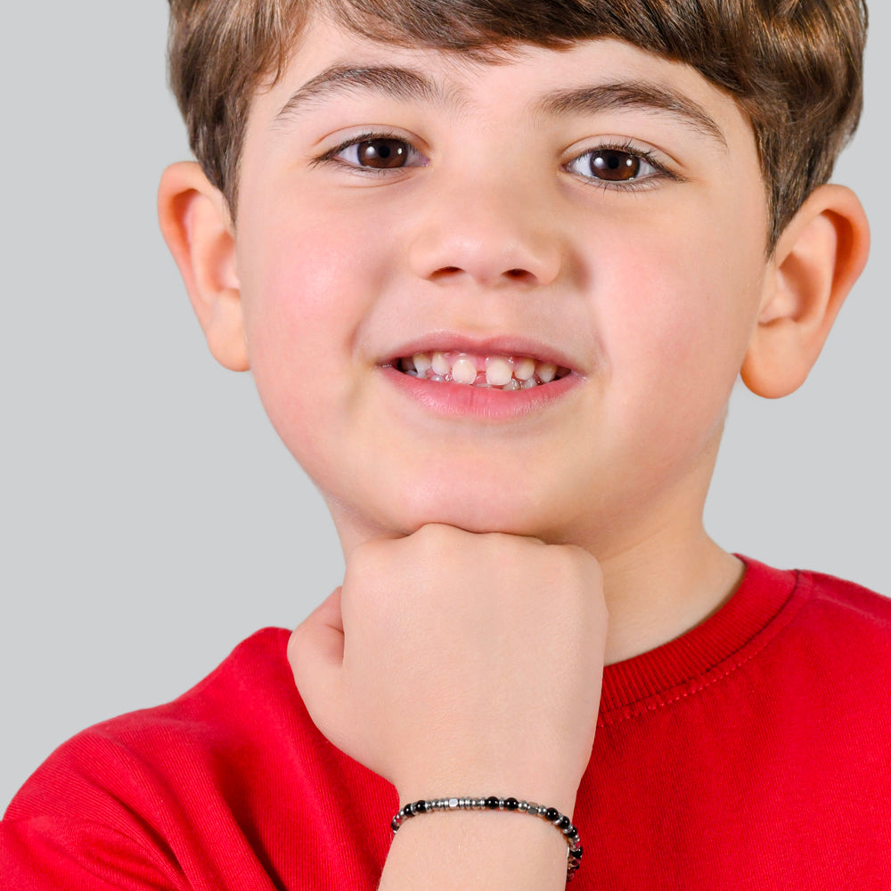 BRACCIALE BAMBINO IN ACCIAIO CON PIETRE NERE E GRIGIE