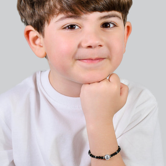 BRACCIALE BAMBINO IN ACCIAIO ANCORA CON PIETRE NERE