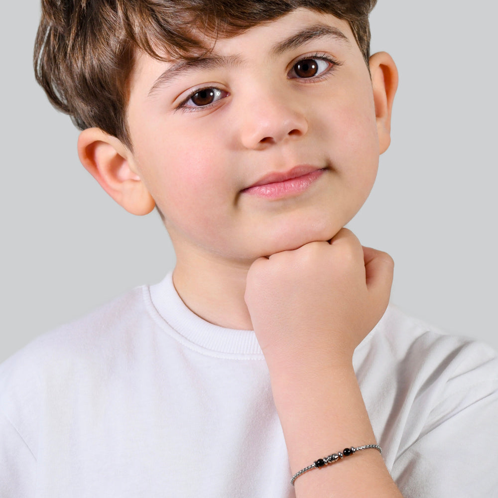 BRACCIALE BAMBINO IN ACCIAIO PIETRE NERE