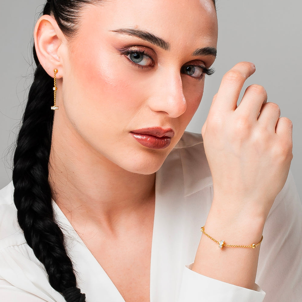 ORECCHINI DONNA IN ACCIAIO IP GOLD, BUSSOLOTTO ED ELEMENTI CON ZIRCONI BIANCHI